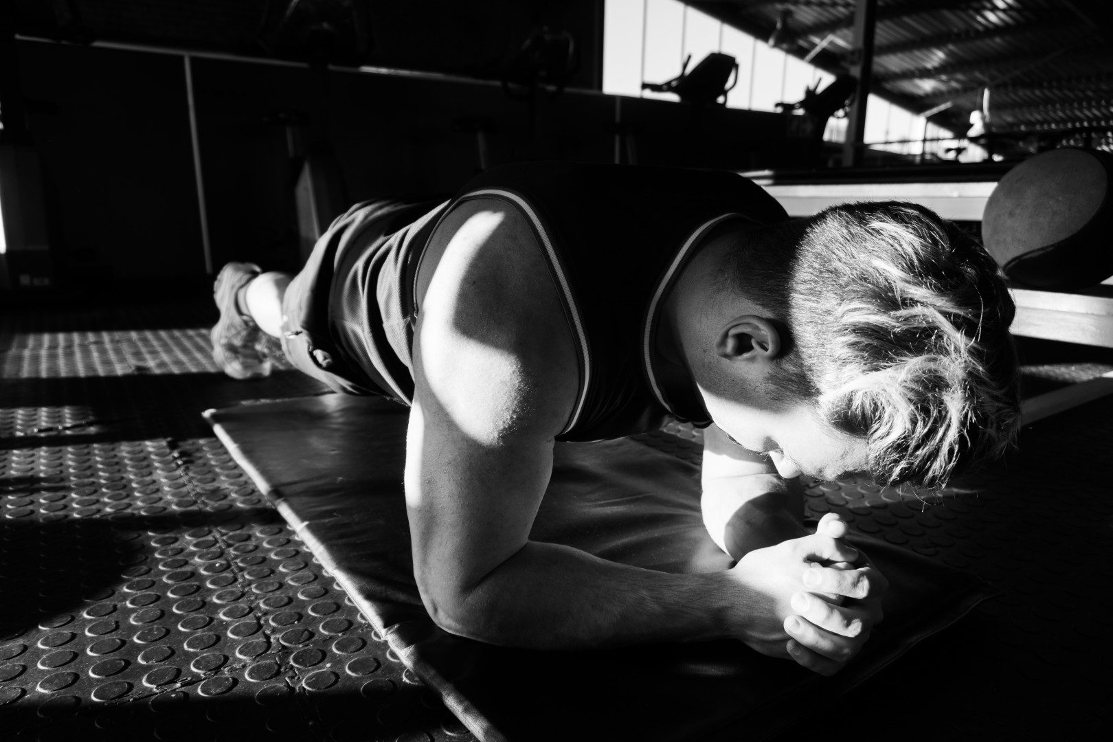 Gym member doing dumbbell shoulder press