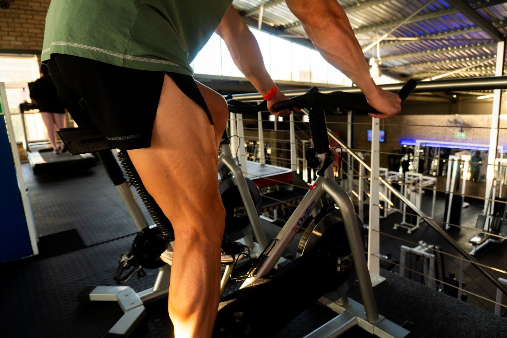 Gym member on spinning bike at Oxigim