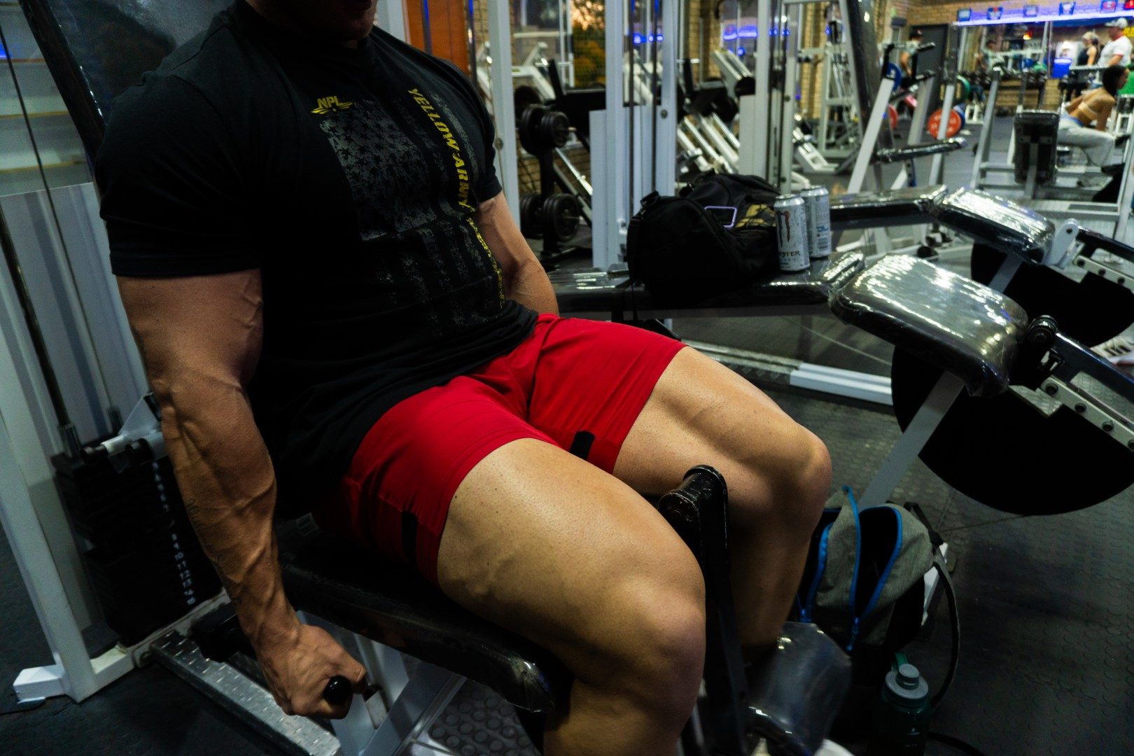 Female member picking dumbbells from rack at Oxigim